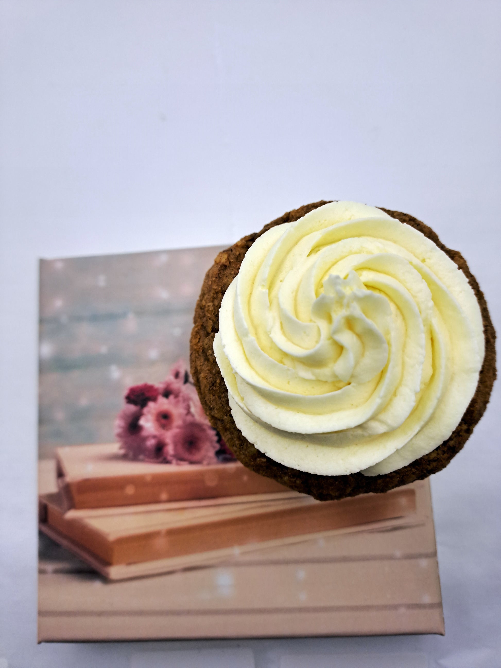 Vegan carrot muffin with vanilla frosting