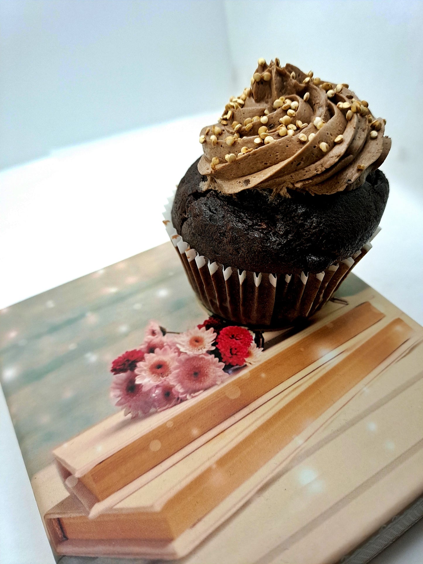 Vegan chocolate muffin with creamy frosting